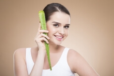 girl smiling and posing with aloe vera 