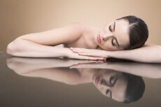 beautiful girl sleeping while posing for the camera