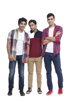 three boys smiling and posing 