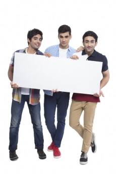 three friends showing placard