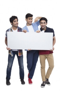 three friends showing placard