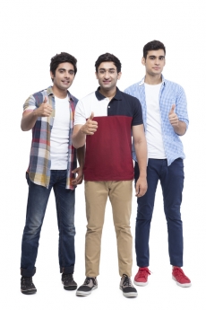 friends posing with thumbs up