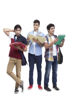 three college friends posing with assignments
