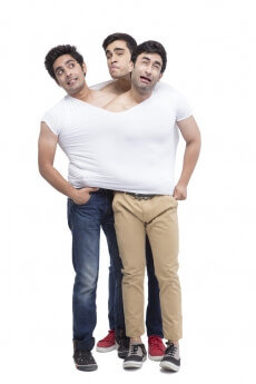 three guys wearing one vest 