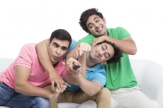 friends fighting for television remote