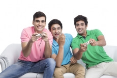 friends playing video game a home 