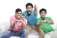 friends playing video game a home 