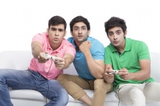 friends playing video game a home 