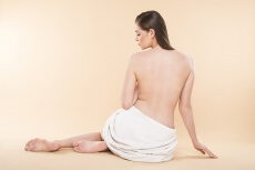 woman showing her bare back 