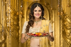 woman in traditional wear with pooja thali