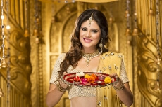woman in traditional wear with pooja thali