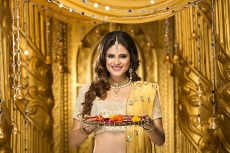 woman in traditional wear with pooja thali