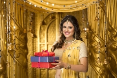 woman in traditional wear with gifts 