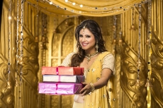 woman in traditional wear with gifts 