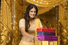 woman in traditional wear with gifts 