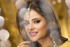 woman in traditional wear smiling and posing 