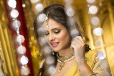 woman in traditional wear smiling and posing 