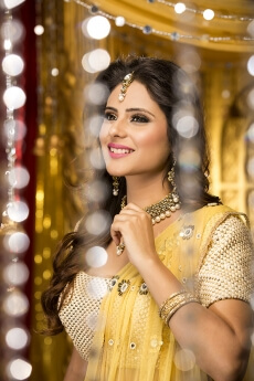 woman in traditional wear smiling and posing 
