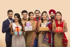 group of indian people posing with gifts