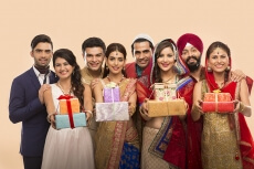 group of indian people posing with gifts