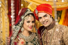 indian bride and groom posing 