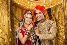 indian bride and groom posing 