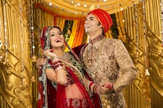 indian bride and groom posing 
