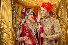 indian bride and groom posing 