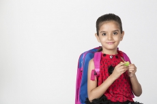 cute girl carrying bag smiling and posing