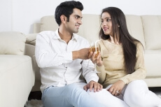 couple posing with champagne glasses 