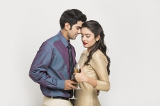 couple posing with champagne glasses 