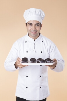 chef with cupcakes
