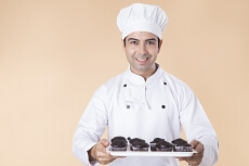 chef with cupcakes