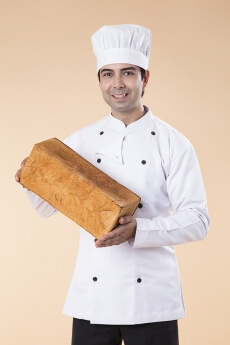 chef with fresh loaf of bread