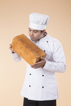 chef with fresh loaf of bread