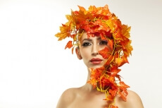 beautiful young woman portraying autumn