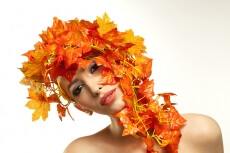 beautiful young woman portraying autumn