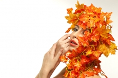 beautiful young woman portraying autumn