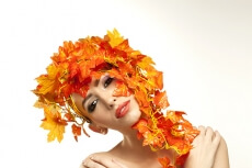 beautiful young woman portraying autumn