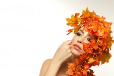 beautiful young woman portraying autumn