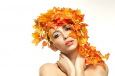 beautiful young woman portraying autumn