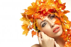 beautiful young woman portraying autumn