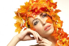 beautiful young woman portraying autumn