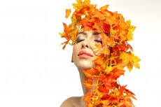 beautiful young woman portraying autumn