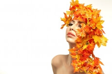 beautiful young woman portraying autumn