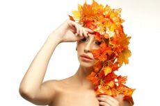 beautiful young woman portraying autumn