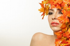 beautiful young woman portraying autumn