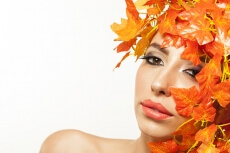 beautiful young woman portraying autumn