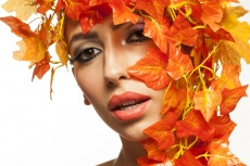 beautiful young woman portraying autumn