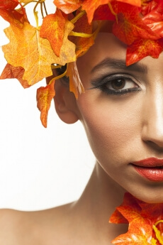 beautiful young woman portraying autumn
